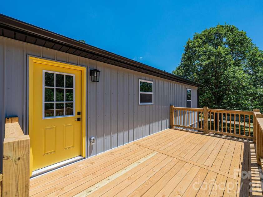 6340 Larry Huffman Street, Connelly Springs, NC 28612.  MLS# CAR4367598, YatesRealty ID 19485. Large back deck for entertaining