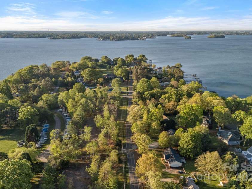 300 Yacht Road, Mooresville, NC 28117.  MLS# CAR4244901, YatesRealty ID 19486. Lake is on both sides of the house