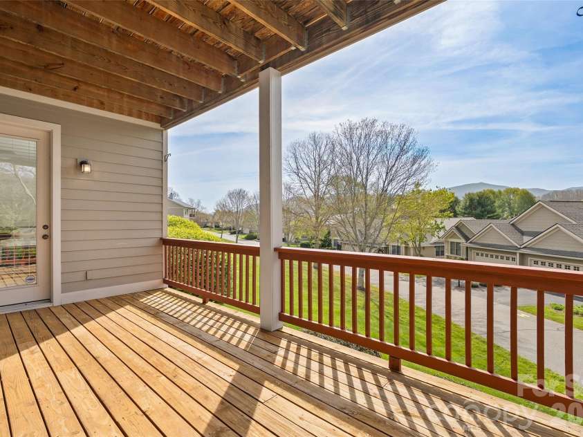 134 Augusta Circle, Waynesville, NC 28786.  MLS# CAR4367921, YatesRealty ID 19487. Mail level deck with view.
