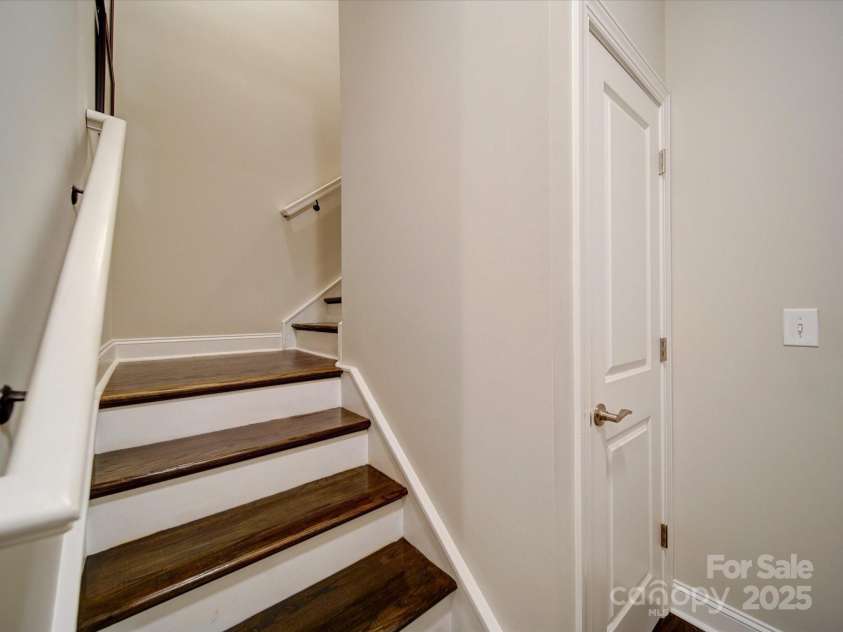 2306 Wesley Landing Road, Waxhaw, NC 28173.  MLS# CAR4248905, YatesRealty ID 19487. Wood stairs to Bonus Suite
