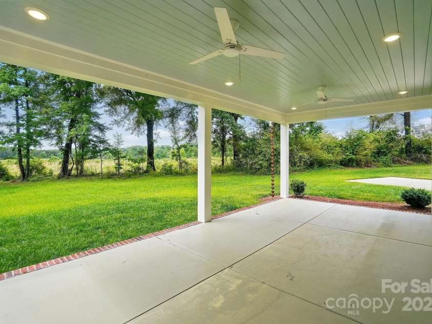 9315 Simpson Road, Waxhaw, NC 28173.  MLS# CAR4258344, YatesRealty ID 19488. Covered Rear Porch