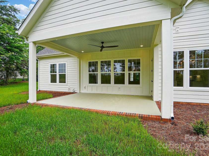 9311 Simpson Road, Waxhaw, NC 28173.  MLS# CAR4258341, YatesRealty ID 19489. Covered Rear Porch