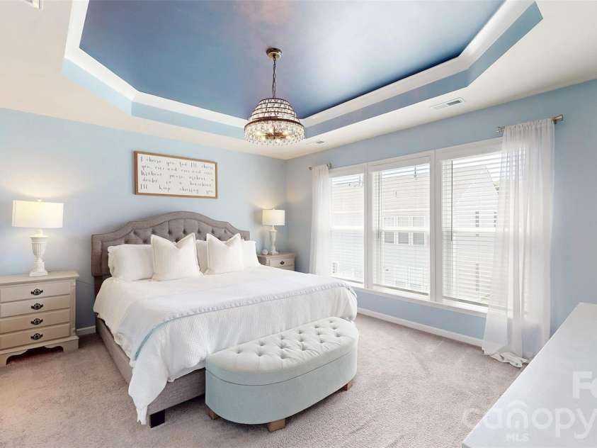 827 Canoe Song Road, Fort Mill, SC 29708.  MLS# CAR4365678, YatesRealty ID 19493. Primary bedroom with stunning tray ceiling.