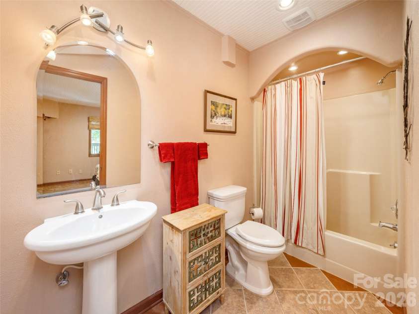142 Sequoyah Hills Drive, Fletcher, NC 28732.  MLS# CAR4372471, YatesRealty ID 19496. Full bathroom with a custom arch