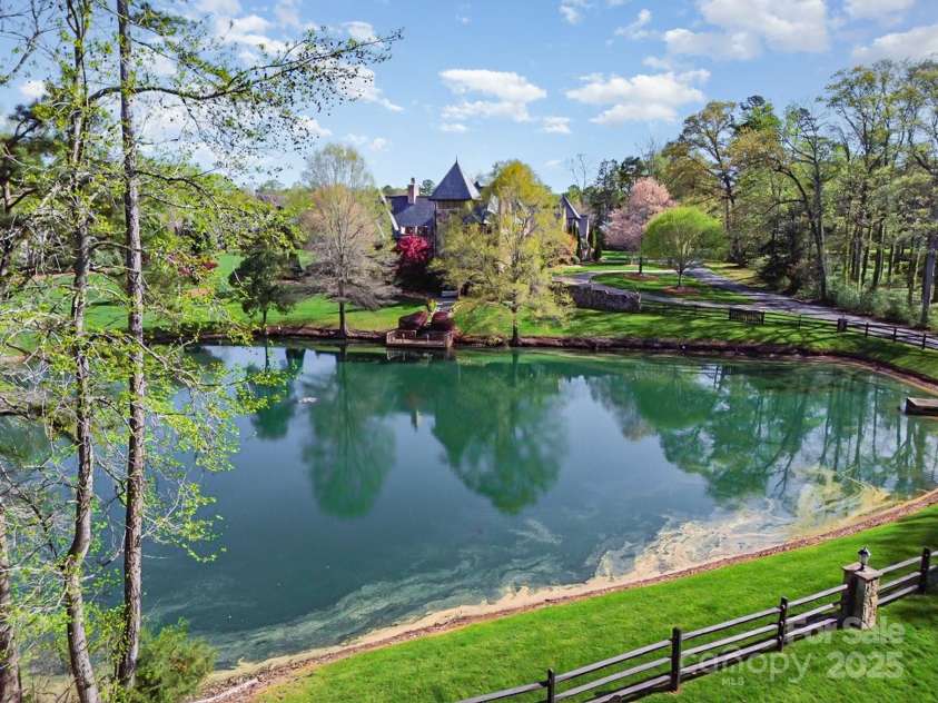 1601 Wandering Way Drive, Charlotte, NC 28226.  MLS# CAR4266480, YatesRealty ID 19498. Pond almost in the backyard!