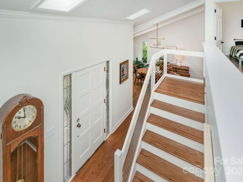 1601 Wandering Way Drive, Charlotte, NC 28226.  MLS# CAR4266480, YatesRealty ID 19498. Stairs to upper level with cool cable railing