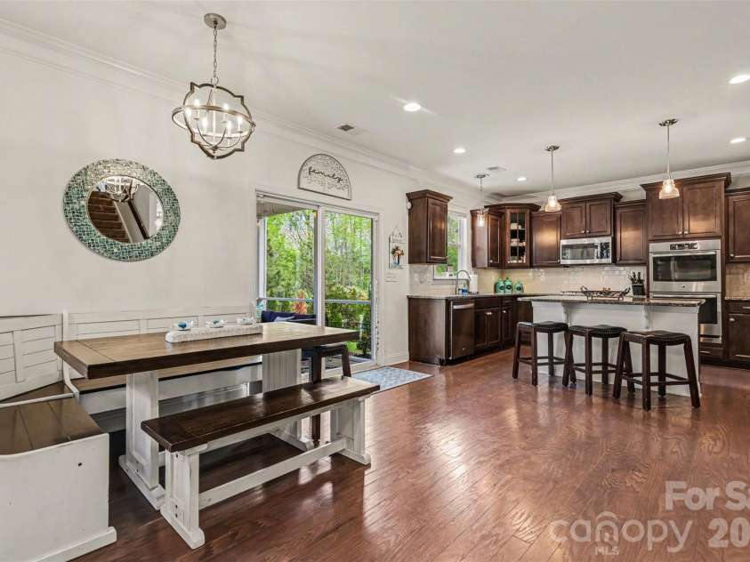 850 Coralbell Way, Fort Mill, SC 29708.  MLS# CAR4365980, YatesRealty ID 19501. Breakfast nook with sliding doors to the screened in porch. 