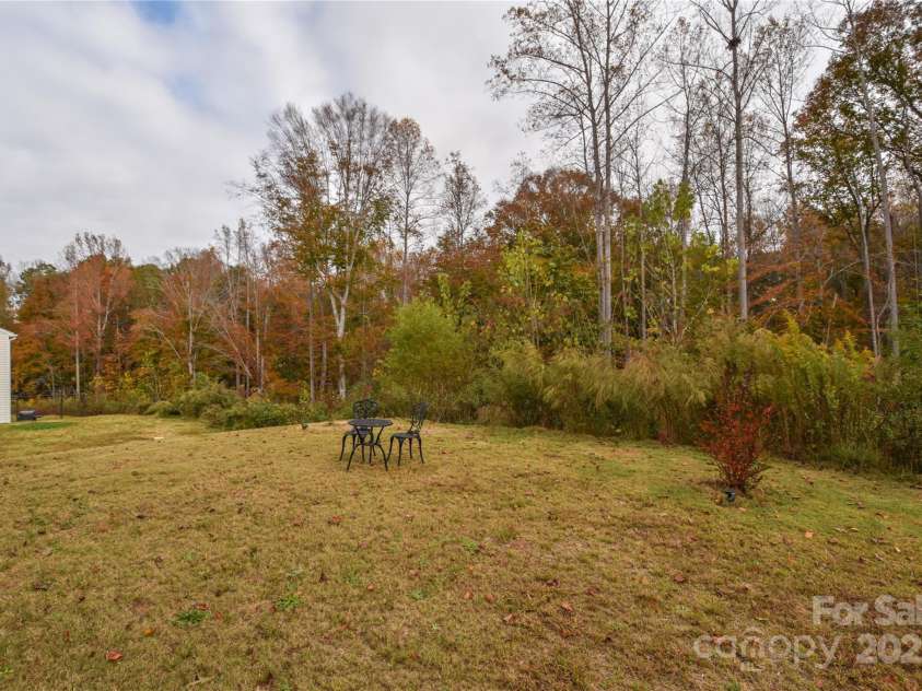 318 Kingsford Drive, Stanley, NC 28164.  MLS# CAR4199660, YatesRealty ID 19503. Privacy with yard backing to woods