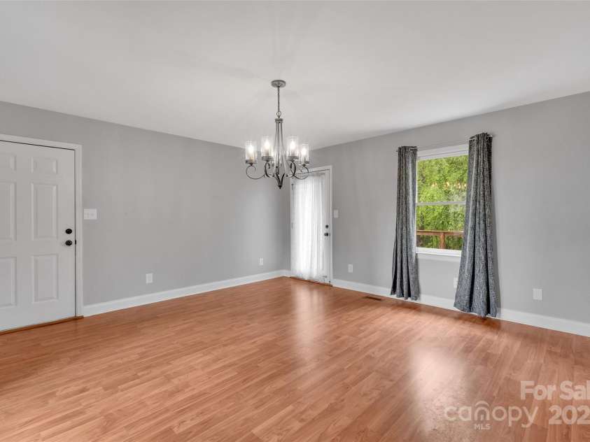 450 Lemmons Road, Mooresboro, NC 28114.  MLS# CAR4248838, YatesRealty ID 19504. Another access to the expansive back dec from the dining room!