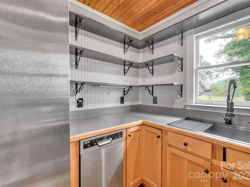 450 Lemmons Road, Mooresboro, NC 28114.  MLS# CAR4248838, YatesRealty ID 19504. Deep stainless steel sink with pull out sprayer and stainless steel appliances