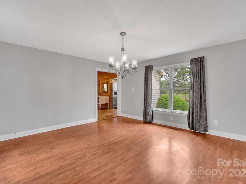 450 Lemmons Road, Mooresboro, NC 28114.  MLS# CAR4248838, YatesRealty ID 19504. Dining area to kitchen and garage to the right
