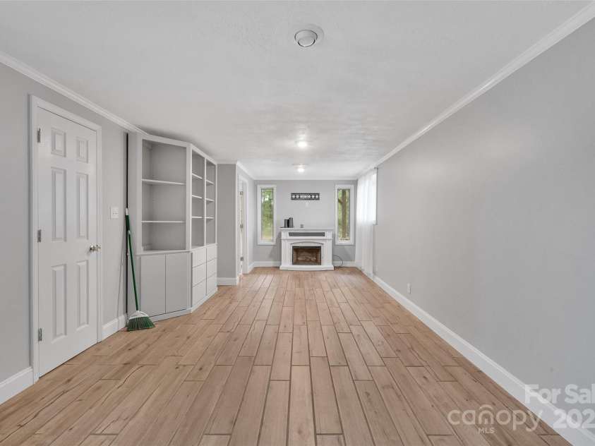 450 Lemmons Road, Mooresboro, NC 28114.  MLS# CAR4248838, YatesRealty ID 19504. Electric FP and walk in closet to the left in downstairs primary (or game room)