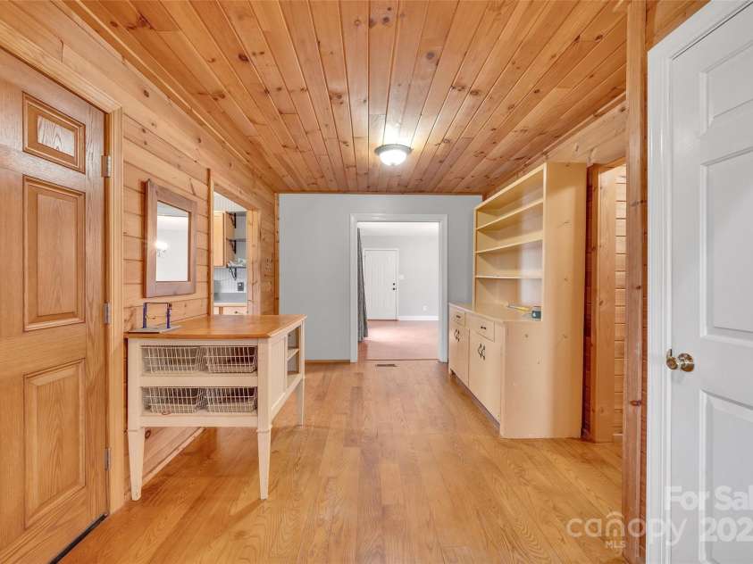 450 Lemmons Road, Mooresboro, NC 28114.  MLS# CAR4248838, YatesRealty ID 19504. Front door and view to dining area with kitchen on the left