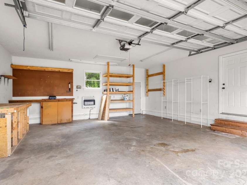 450 Lemmons Road, Mooresboro, NC 28114.  MLS# CAR4248838, YatesRealty ID 19504. Plenty of garage with workbenches