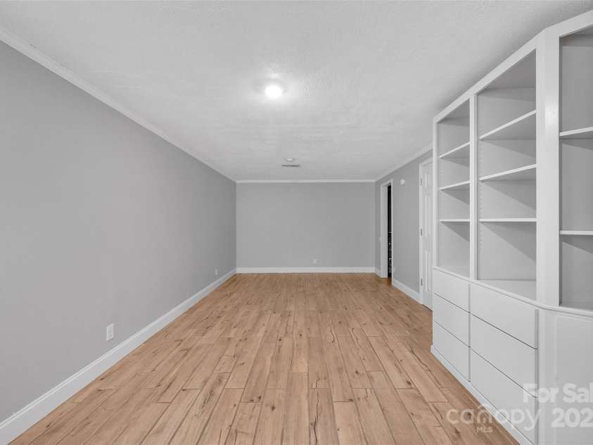 450 Lemmons Road, Mooresboro, NC 28114.  MLS# CAR4248838, YatesRealty ID 19504. Primary lower level bedroom or could be a finished game room for an air bnb