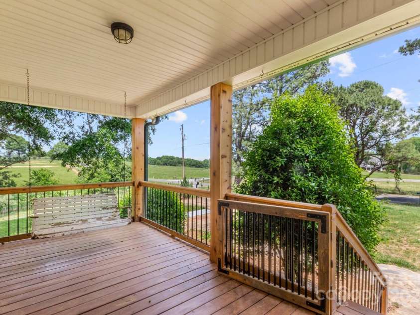 450 Lemmons Road, Mooresboro, NC 28114.  MLS# CAR4248838, YatesRealty ID 19504. Rocking chair front porch greets you,