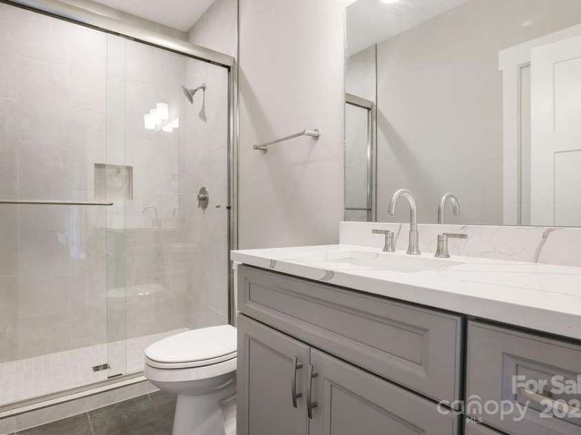 175 Waightstill Drive, Arden, NC 28704.  MLS# CAR3874338, YatesRealty ID 19507. Lower-level Guest Bath