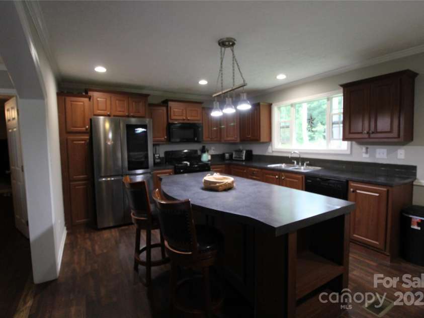 2310 Alfred Hartley Road, Lenoir, NC 28645.  MLS# CAR4258802, YatesRealty ID 19511. Cooks kitchen with lots of cabinets and a large island.