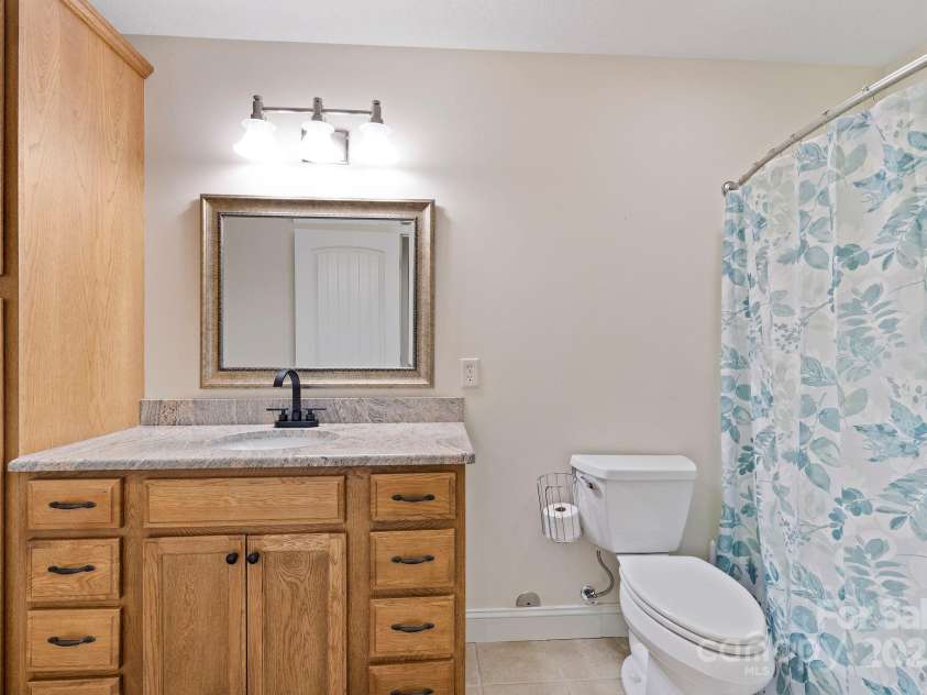 21 Hope Road, Weaverville, NC 28787.  MLS# CAR4261300, YatesRealty ID 19512. Full downstairs bathroom