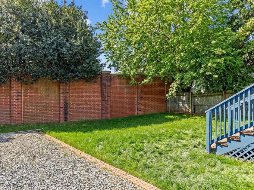 806 Sunnyside Avenue, Charlotte, NC 28204.  MLS# CAR4241141, YatesRealty ID 19524. Brick wall is sound barrier for 74