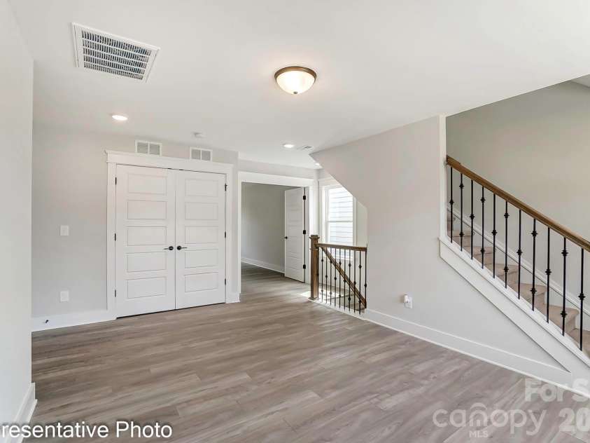 13118 Foxberry Road, Charlotte, NC 28213.  MLS# CAR4353973, YatesRealty ID 19528. Example of loft with stairs to third floor