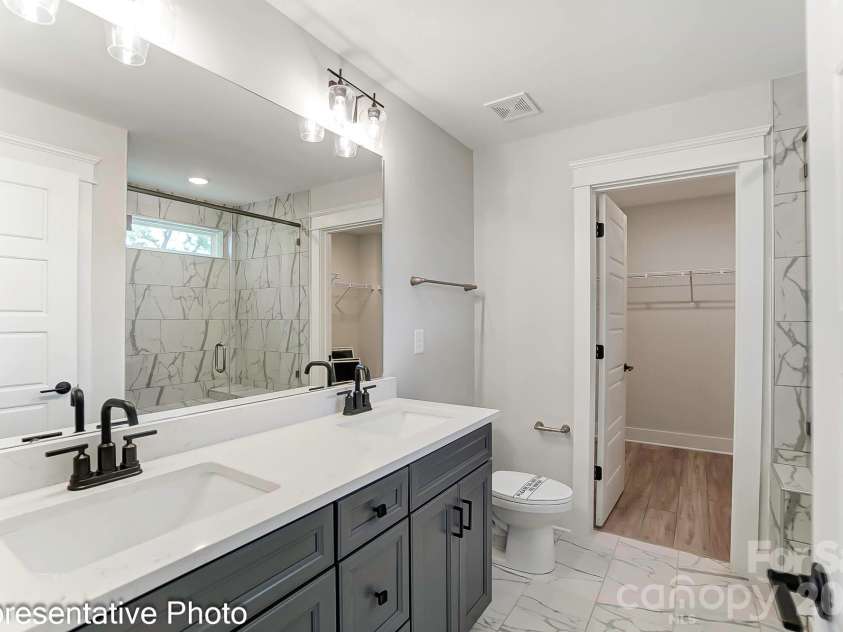 13118 Foxberry Road, Charlotte, NC 28213.  MLS# CAR4353973, YatesRealty ID 19528. Primary bathroom example