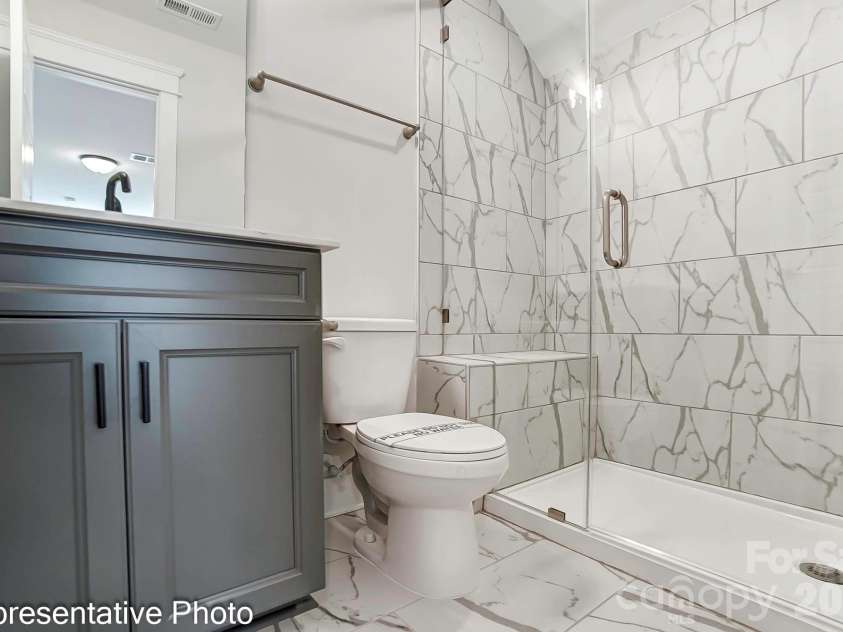 13118 Foxberry Road, Charlotte, NC 28213.  MLS# CAR4353973, YatesRealty ID 19528. Third-floor bathroom example