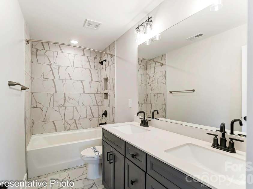 13118 Foxberry Road, Charlotte, NC 28213.  MLS# CAR4353973, YatesRealty ID 19528. Upstairs bathroom example