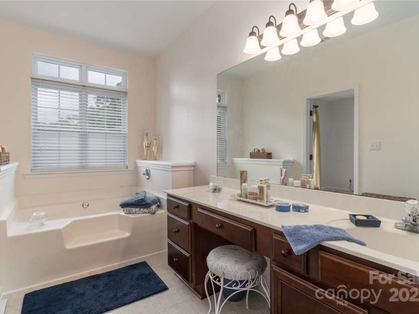 8593 Bailey Drive, Terrell, NC 28682.  MLS# CAR4269255, YatesRealty ID 19532. Large vanity with make-up area and soaker tub.