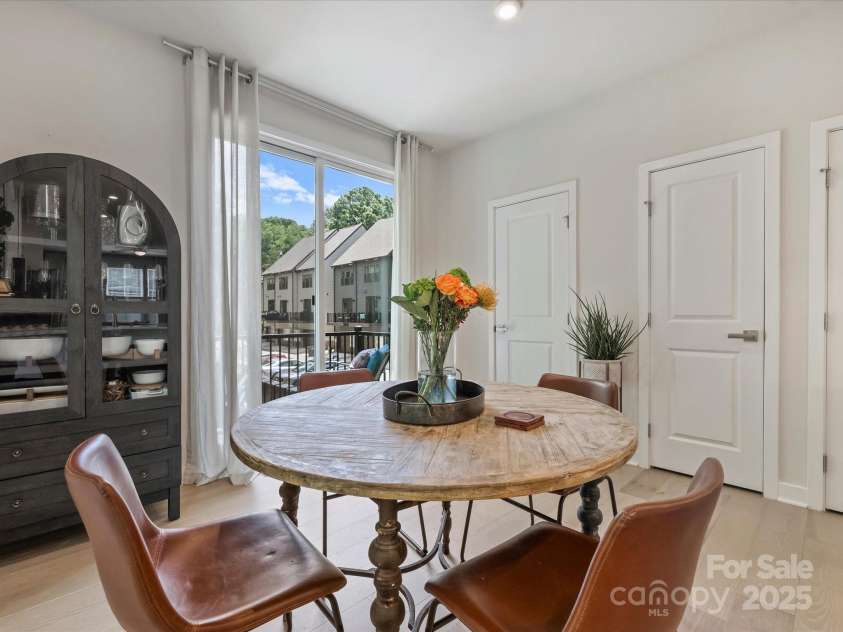513 Cubitt Court, Charlotte, NC 28205.  MLS# CAR4264462, YatesRealty ID 19533. Dining area open to balcony