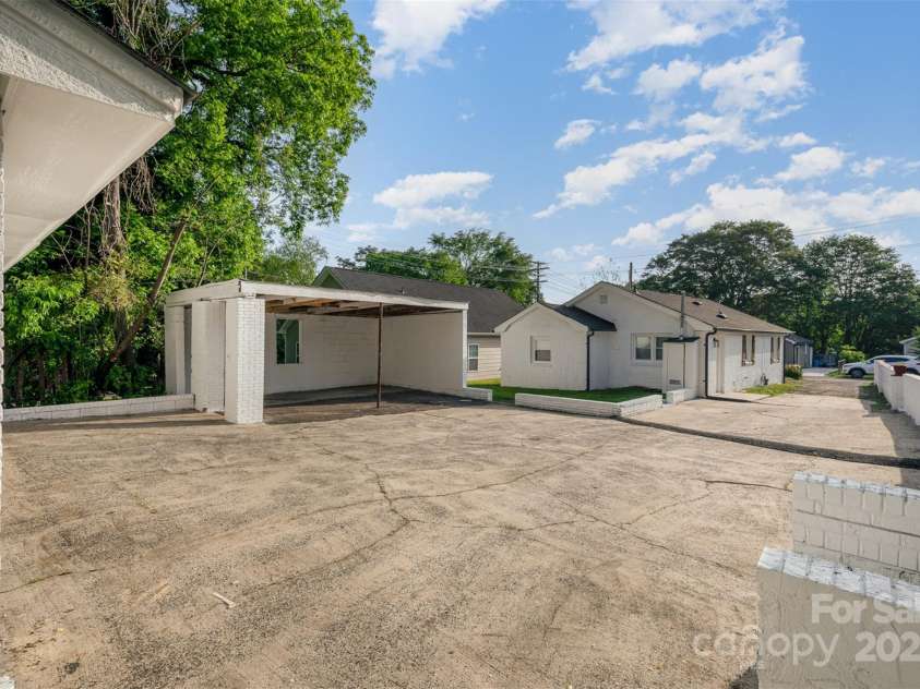 1211 Boyce Street, Gastonia, NC 28052.  MLS# CAR4253873, YatesRealty ID 19537. Exterior Terrace, Back of the home, Carport