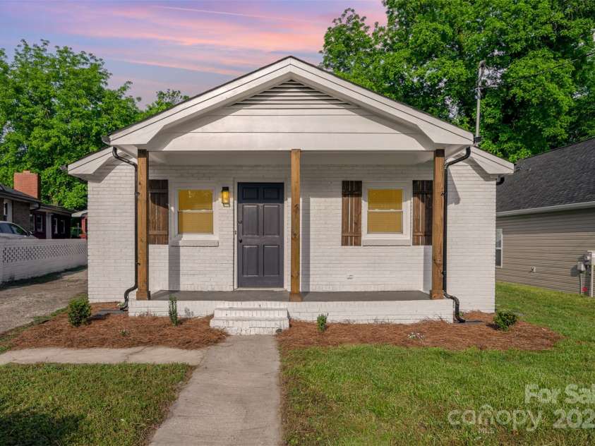 1211 Boyce Street, Gastonia, NC 28052.  MLS# CAR4253873, YatesRealty ID 19537. Front of the house (dusk)