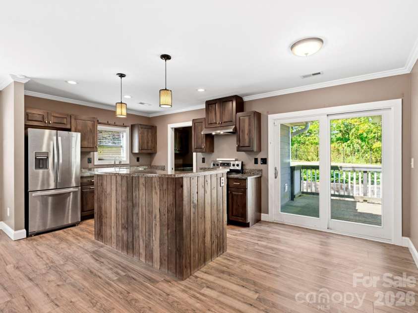 3333 Chimney Rock Road, Hendersonville, NC 28792.  MLS# CAR4349210, YatesRealty ID 19539. Dining Area opens to Side Deck