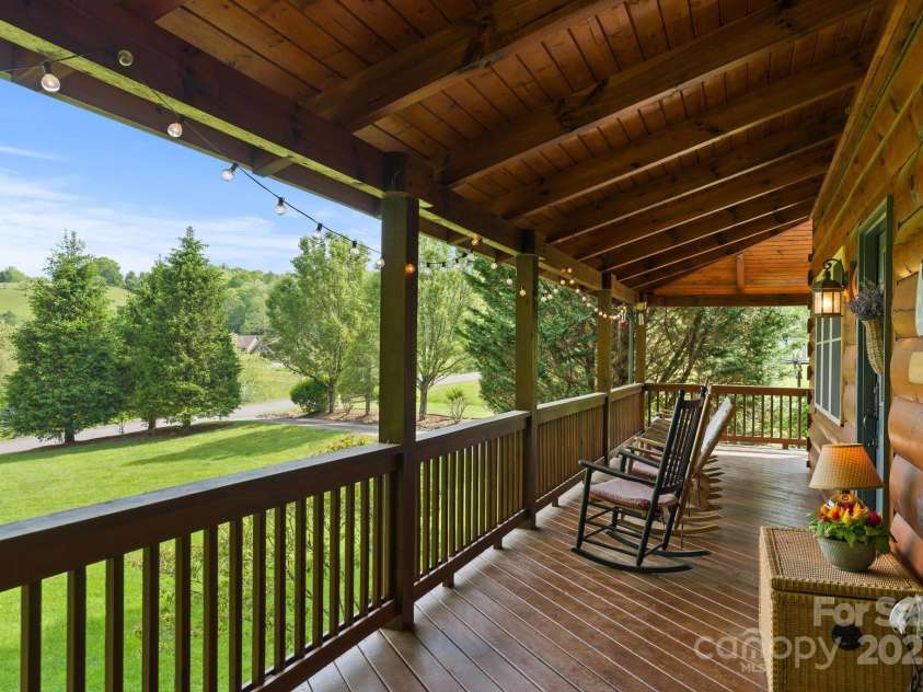 201 Cherokee Circle, Jefferson, NC 28640.  MLS# CAR4263707, YatesRealty ID 19540. Front porch with pastoral and mountain views