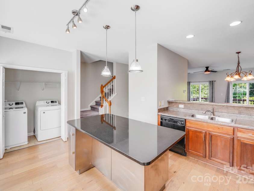 9800 Walkers Glen Drive, Concord, NC 28027.  MLS# CAR4265265, YatesRealty ID 19543. CONVENIENT WASHER DRYER ATTACHED TO KITCHEN