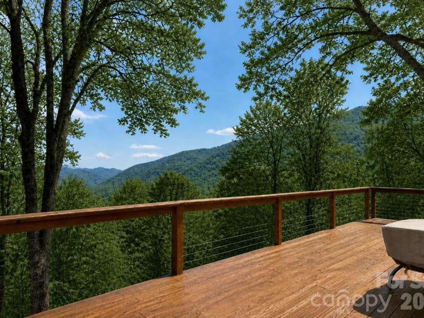 208 Buckeye Road, Maggie Valley, NC 28751.  MLS# CAR4372211, YatesRealty ID 19545. Full Length open deck