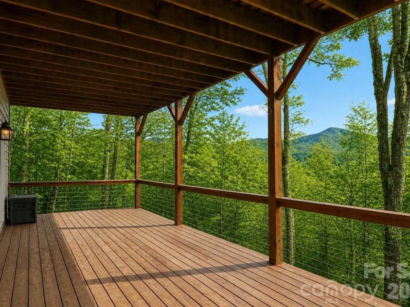 208 Buckeye Road, Maggie Valley, NC 28751.  MLS# CAR4372211, YatesRealty ID 19545. Lower level deck accessed from bedroom