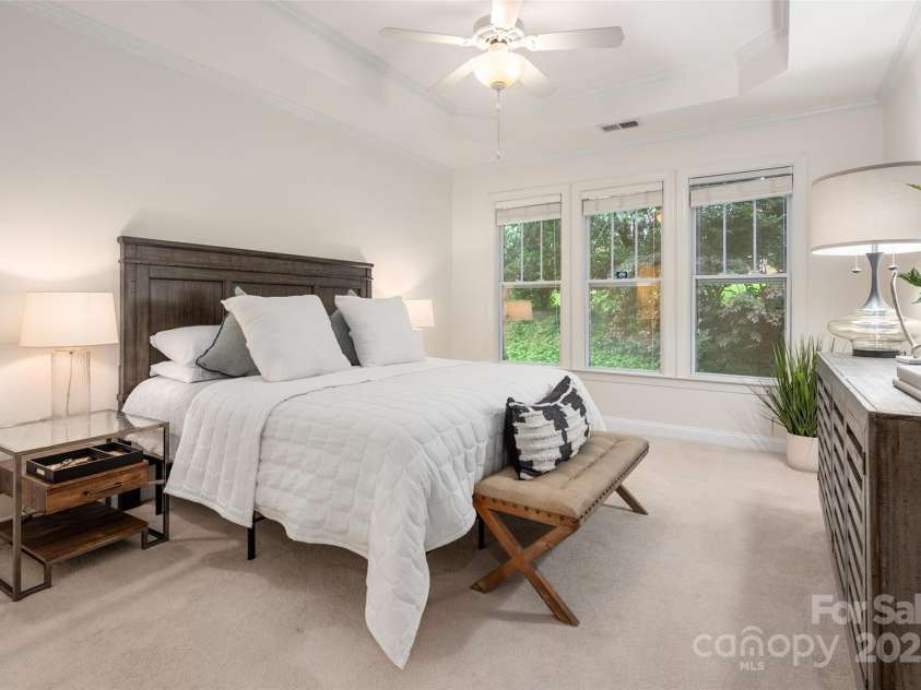 2941 Bellasera Way, Matthews, NC 28105.  MLS# CAR4226278, YatesRealty ID 19549. Spacious primary bedroom featuring a private en suite bath.