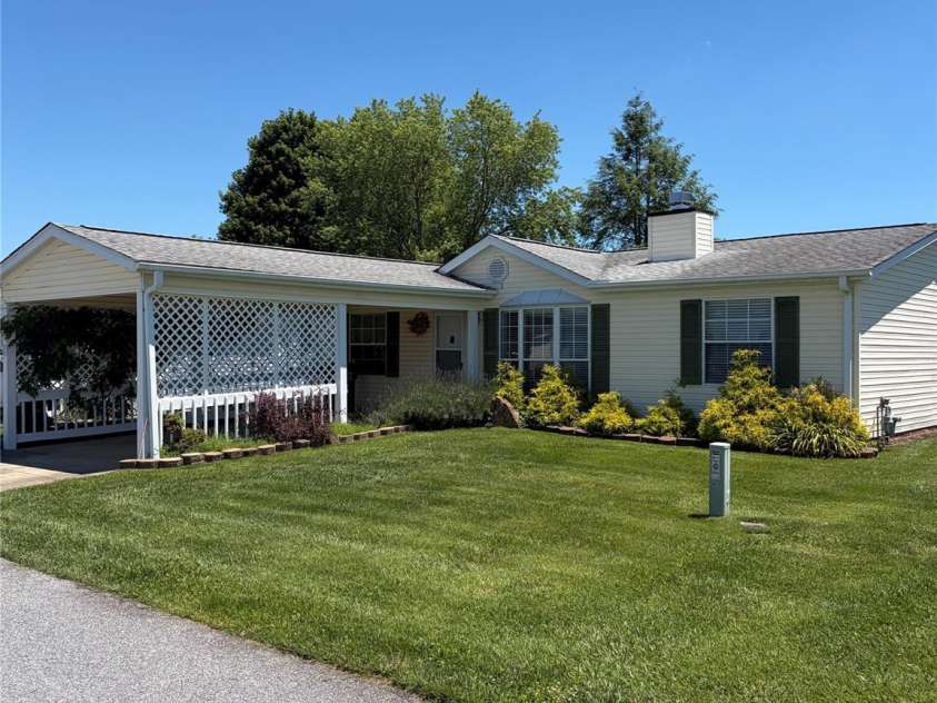 261 White Ash Circle, Hendersonville, NC 28739.  MLS# CAR4338234, YatesRealty ID 19554. Side Front