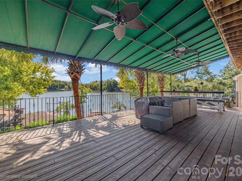 5650 Riverfront Road, Clover, SC 29710.  MLS# CAR4310458, YatesRealty ID 19574. Main house trek decking off kitchen