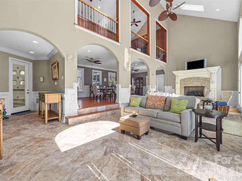 5650 Riverfront Road, Clover, SC 29710.  MLS# CAR4310458, YatesRealty ID 19574. Wing - Great room with fireplace and balcony