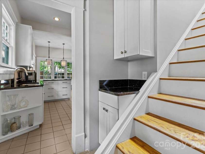 506 Clement Avenue, Charlotte, NC 28204.  MLS# CAR4266566, YatesRealty ID 19575. Stairs to Primary Loft Bedroom and into Kitchen