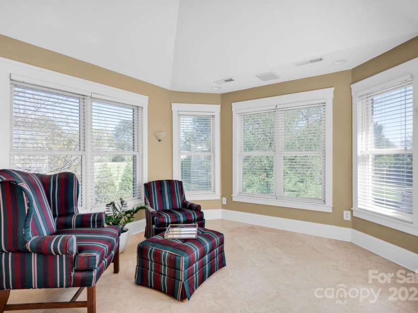 12932 Westmoreland Farm Road, Davidson, NC 28036.  MLS# CAR4243710, YatesRealty ID 19584. Sunroom off primary suite with access to deck