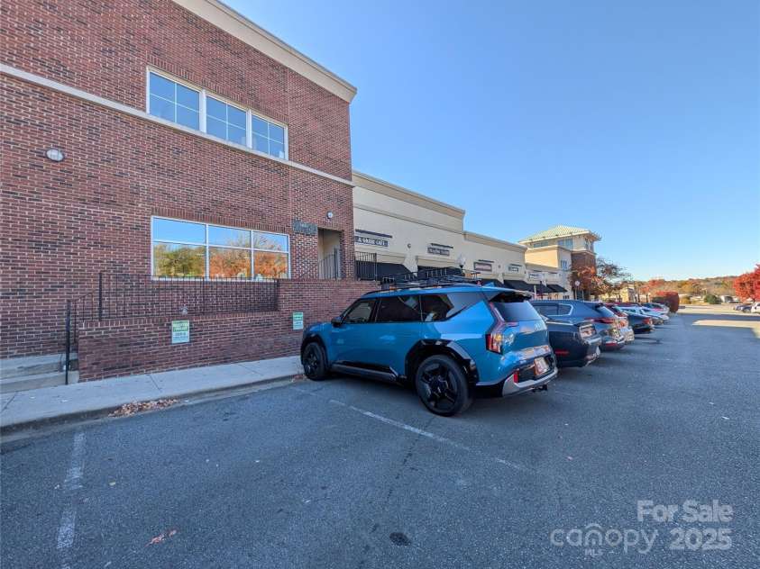 360 Exchange Street, Concord, NC 28027.  MLS# CAR4321208, YatesRealty ID 1959. Designated parking for your home with a secure locked entrance to the  stairwell with an intercom system to announce your guests.