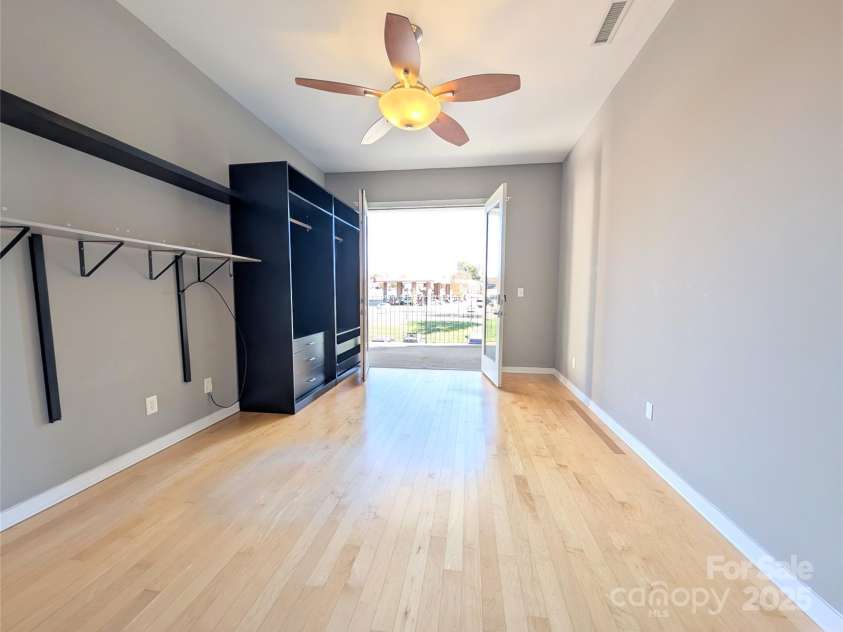 360 Exchange Street, Concord, NC 28027.  MLS# CAR4321208, YatesRealty ID 1959. Main living area - wonderful space saving shelving that remains with the unit - 