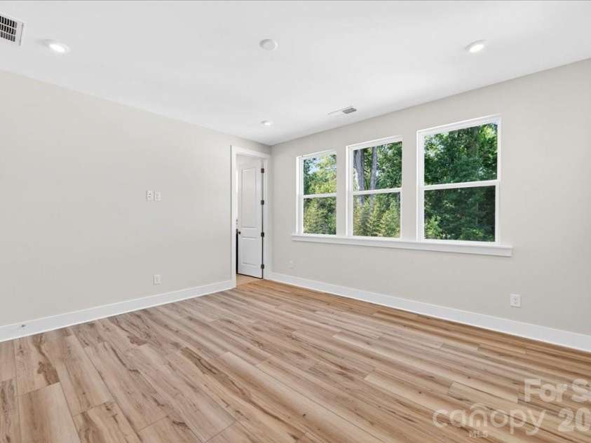 6022 Pivot Court, Charlotte, NC 28205.  MLS# CAR4370511, YatesRealty ID 19590. Light filled primary bedroom 