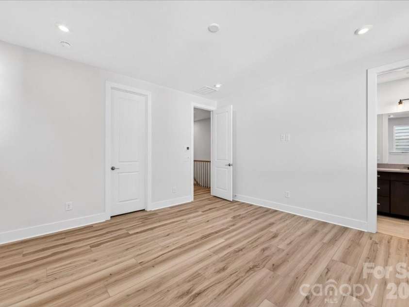 6022 Pivot Court, Charlotte, NC 28205.  MLS# CAR4370511, YatesRealty ID 19590. Light filled primary bedroom