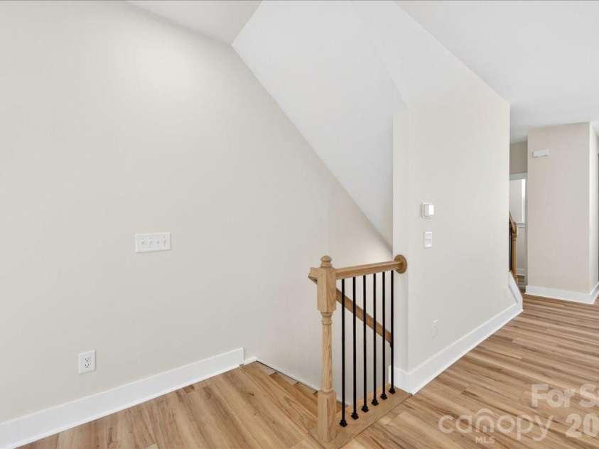 6022 Pivot Court, Charlotte, NC 28205.  MLS# CAR4370511, YatesRealty ID 19590. Second floor landing with open rails