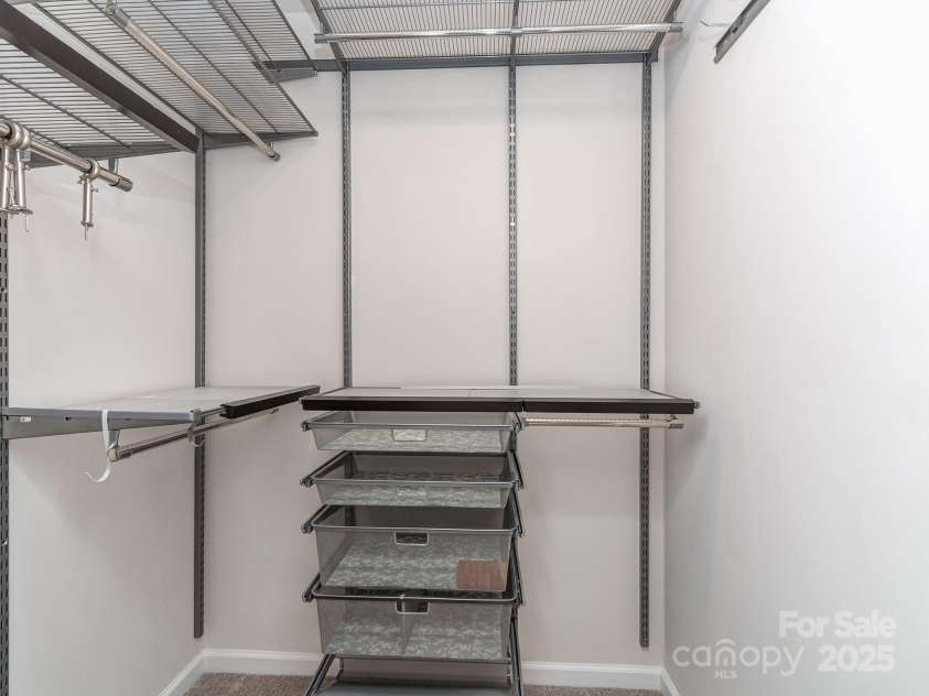 12214 Ardrey Park Drive, Charlotte, NC 28277.  MLS# CAR4247491, YatesRealty ID 19591. Organized walk-in closet & linen closet.