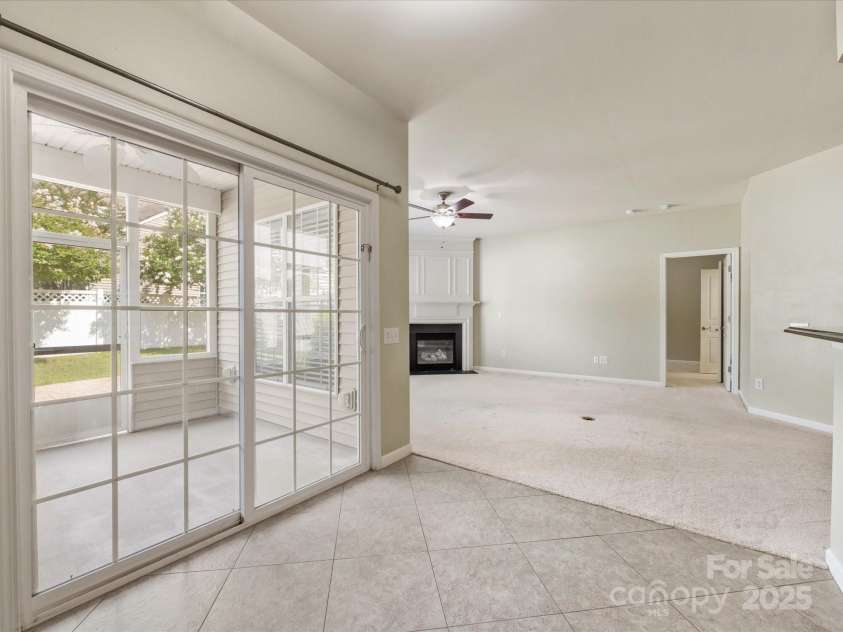 8603 Robinson Meadow Court, Charlotte, NC 28277.  MLS# CAR4265734, YatesRealty ID 19593. The breakfast nook is open to the family room and has access to the screened porch and patio.